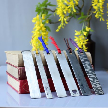 A selection of metal bookmarks with coloured tassels