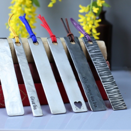 A selection of metal bookmarks with coloured tassels